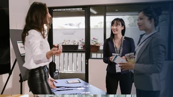 three women attending a trade show 